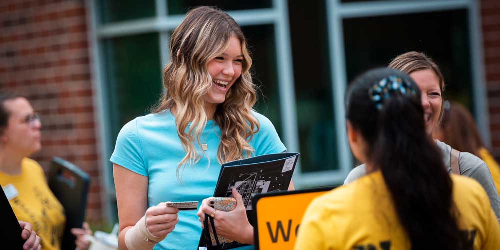 A student is all smiles during Black and Gold week and MU