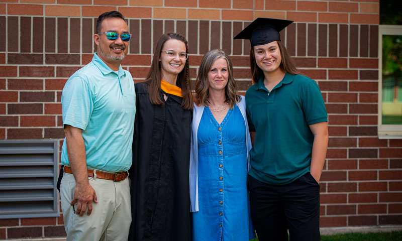 A family celebrates together at MU's graduation ceremony