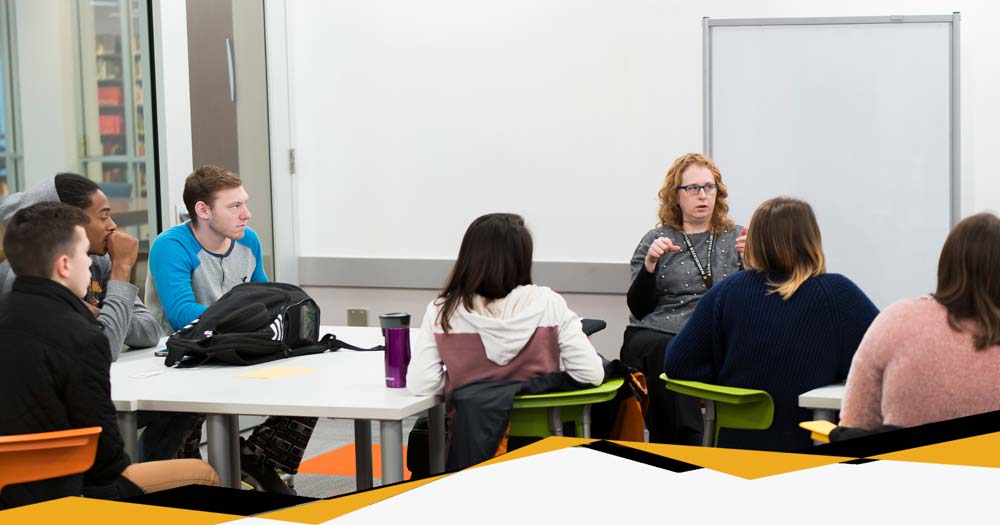 Students work together under guidance of MU instructor within the classroom